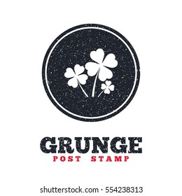 Grunge post stamp. Circle banner or label. Clovers with four leaves sign icon. Saint Patrick symbol. Dirty textured web button. Vector