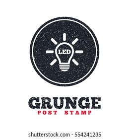 Grunge post stamp. Circle banner or label. Led light lamp icon. Energy symbol. Dirty textured web button. Vector