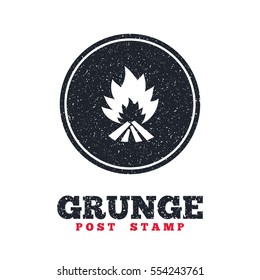 Grunge post stamp. Circle banner or label. Fire flame sign icon. Heat symbol. Stop fire. Escape from fire. Dirty textured web button. Vector