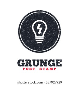 Grunge post stamp. Circle banner or label. Light lamp sign icon. Bulb with lightning symbol. Idea symbol. Dirty textured web button. Vector