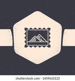 Grunge Postal stamp and Egypt pyramids icon isolated on grey background. Monochrome vintage drawing. Vector Illustration