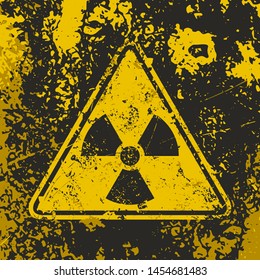 Grunge poster Radioactive. Vector illustration of triangle sign Ionizing radiation on grunge dirty yellow background. It can be used as a poster, t-shirts and other design projects.