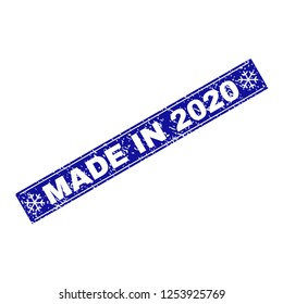 Grunge rectangle Made in 2020 stamp seal with snowflakes and lines. Vector Made in 2020 grunge stamp in winter style. Blue colored rectangle with dirty surface.