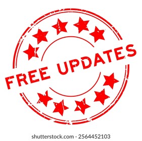 Grunge red free updates word round rubber seal stamp on white background

