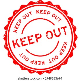 Grunge red keep out word round rubber seal stamp on white background
