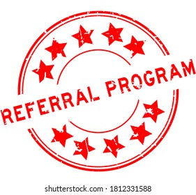 Grunge red referral program word with star icon round rubber seal stamp on white background