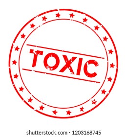 Grunge red toxic word round rubber seal stamp on white background