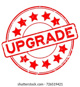 Grunge red upgrade wording with star icon round rubber seal stamp on white background