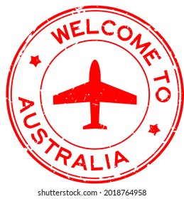 Grunge red welcome to Australia word with airplane icon round rubber seal stamp on white background