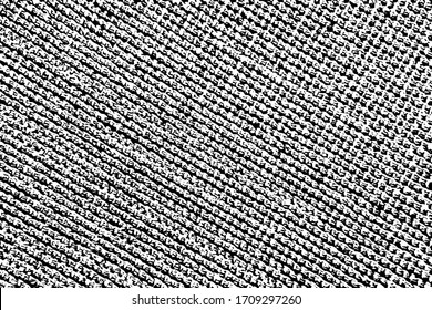 Grunge rough texture of the burlap with braided strands on the diagonal. Abstract background of natural rough fabric. Vector illustration. Overlay template.