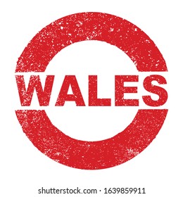 A grunge rubber ink stamp with the text Wales over a white background