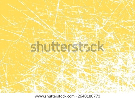Grunge scratched texture with a yellow background illustrating aged surface elements and rough scratch marks perfect for graphic design projects