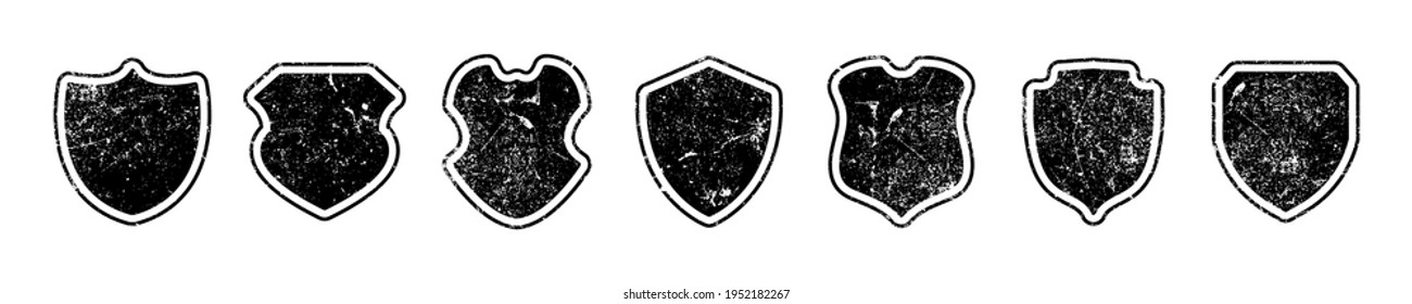 Grunge shields collection. Textured forms for logo or label design. Vector set