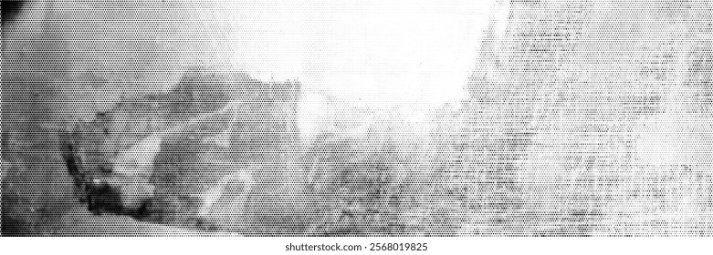 Grunge spotted background with halftone effect. Monochrome print of a scratched, dirty wall.