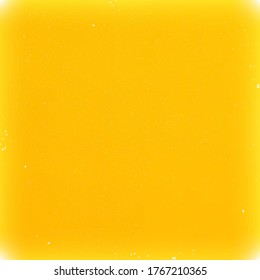 Grunge style bright yellow vector background with small particles