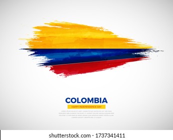 Grunge style brush painted Colombia country flag illustration with Independence day typography. Artistic watercolor brush flag vector