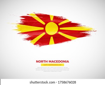 Grunge style brush painted North Macedonia country flag illustration with Independence day typography. Artistic watercolor brush flag vector
