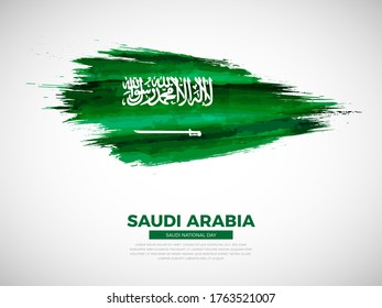 Grunge style brush painted Saudi Arabia country flag illustration with national day typography. Artistic watercolor brush flag vector