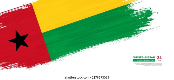 Grunge style Guinea-Bissau flag with hand drawn brush stroke vector illustration