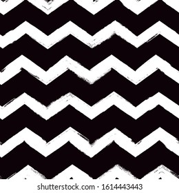 Grunge style seamless pattern. Repeated zigzag motif. Modern minimal geometric surface print. Freehand brush design texture. Handdrawn doodle contemporary ornament. Vector abstract background