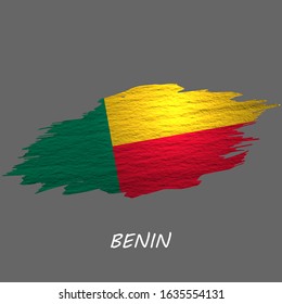 Grunge styled flag of Benin. Brush stroke background