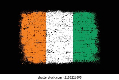 Grunge styled flag of cote d'ivoire. Brush stroke background