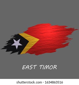 Grunge styled flag of East Timor. Brush stroke background