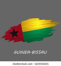 Grunge styled flag of Guinea-Bissau. Brush stroke background