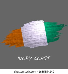 Grunge styled flag of Ivory Coast. Brush stroke background