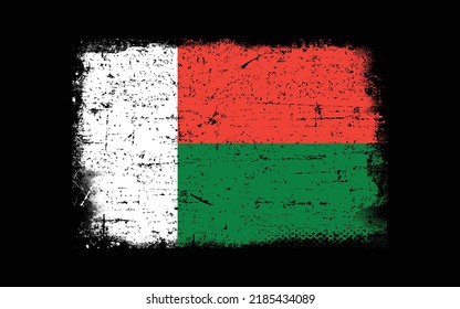 Grunge styled flag of Madagascar. Brush stroke background