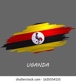 Grunge styled flag of Uganda. Brush stroke background