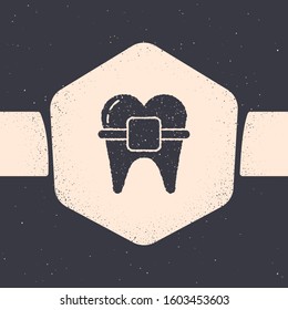 Grunge Teeth with braces icon isolated on grey background. Alignment of bite of teeth, dental row with with braces. Dental concept. Monochrome vintage drawing. Vector Illustration