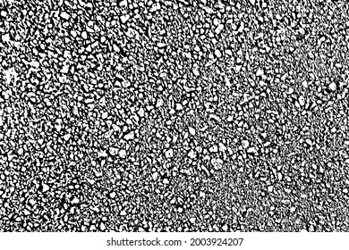 Grunge texture of asphalt. Monochrome background of a close-up of the road surface with spots, noise and grain. Overlay template. Vector illustration
