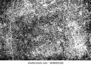 The grunge texture is black and white. Monochrome abstract background. Pattern of scratches, chips, and paint strokes. Black smudges, scuffing, wear and tear