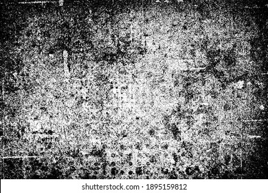 The grunge texture is black and white. Monochrome abstract background. Pattern of scratches, chips, and paint strokes. Black smudges, scuffing, wear and tear