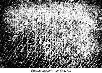 The grunge texture is black and white. Monochrome abstract background. Pattern of scratches, chips, and paint strokes. Black smudges, scuffing, wear and tear