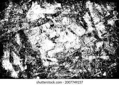 The grunge texture is black and white. Monochrome abstract background. Pattern of scratches, chips, and paint strokes. Black smudges, scuffing, wear and tear