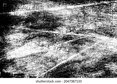 The grunge texture is black and white. Monochrome abstract background. Pattern of scratches, chips, and paint strokes. Black smudges, scuffing, wear and tear