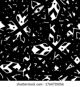 The grunge texture is black and white. Seamless abstract background. Monochrome repeating pattern
