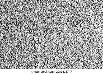 Grunge texture of a rough concrete surface with fine grains of sand, grains, random dots, particles. Abstract urban background. Vector illustration. Overlay template.