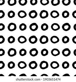 Grunge texture seamless pattern of different circles. Black stains design elements on white background. Vector illustration for wallpaper, greeting card, wrapping paper, textile, cover