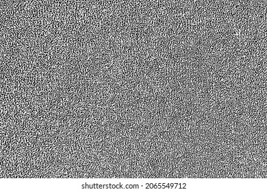 Grunge texture of the surface of a terry towel. Monochrome background of soft textile with loops, noise and grain. Overlay template. Vector illustration