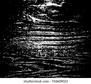 Grunge texture. A white spot scratched on a black background. Vector illustration