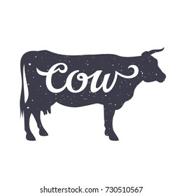 Grunge textured Cow silhouette with a calligraphic inscription "Cow". Vector illustration