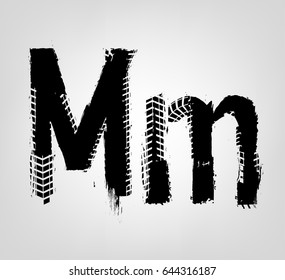 Grunge tire letter M. Unique off road isolated lettering in a black colour. Vector illustration.