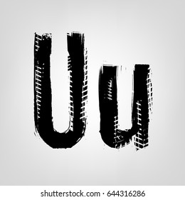 Grunge tire letter U. Unique off road isolated lettering in a black colour. Vector illustration.