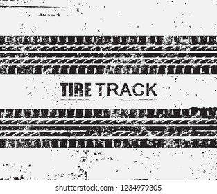 Grunge tire tracks background.Dirty textured tire tracks.