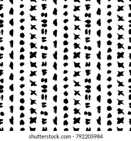 Grunge tribal seamless vector pattern. White background. Hand drawing ethnic design elements. Ink brush strokes. Dotted, spots, triangles, ovals, circles, sticks and crosses