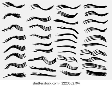 Grunge vector dry paint brush strokes. Collection of paint stripes and waves, free hand drawing