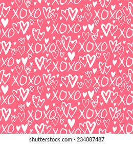 Grunge vector seamless pattern with hand painted hearts and words xoxo. Bright pink bold print for valentines day decor or wedding invitation card background